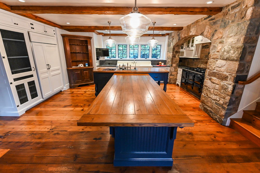 Rustic Traditional White & Navy Kitchen with Black AGA Range, Wood Top Island & Soapstone Countertops