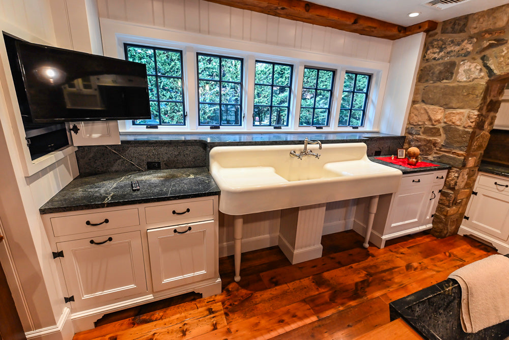 Rustic Traditional White & Navy Kitchen with Black AGA Range, Wood Top Island & Soapstone Countertops