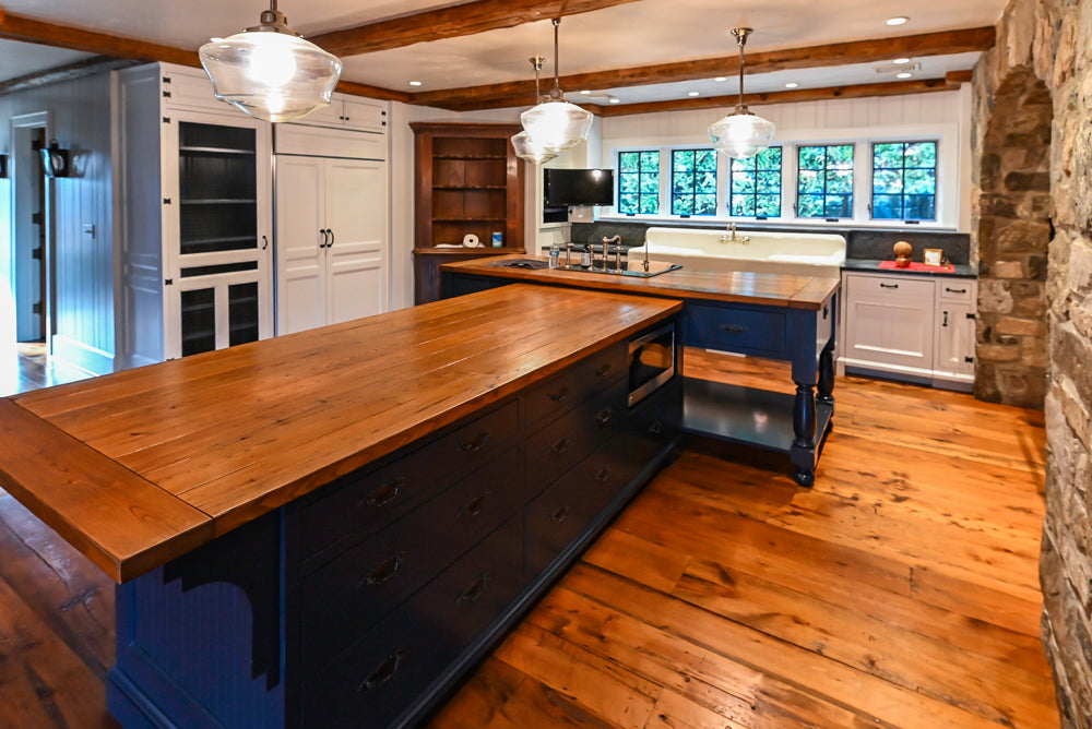 Rustic Traditional White & Navy Kitchen with Black AGA Range, Wood Top Island & Soapstone Countertops