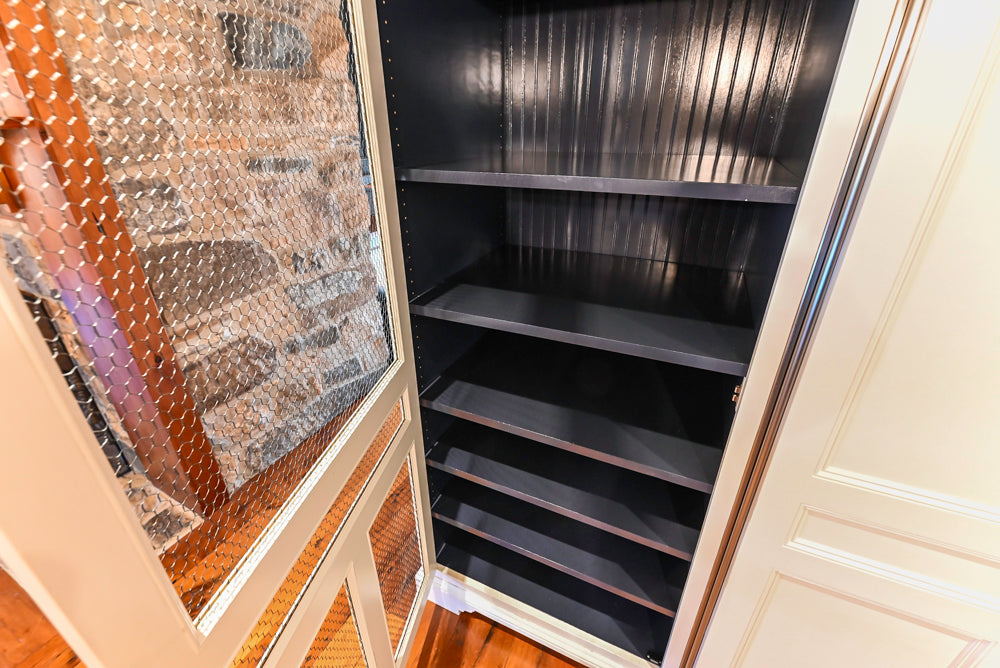 Rustic Traditional White & Navy Kitchen with Black AGA Range, Wood Top Island & Soapstone Countertops