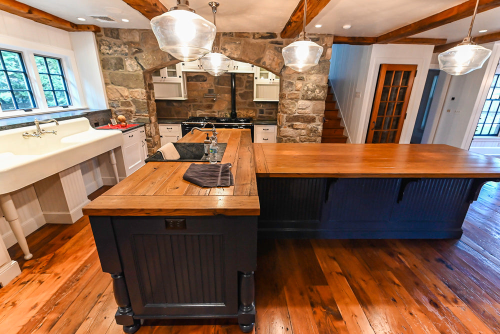 Rustic Traditional White & Navy Kitchen with Black AGA Range, Wood Top Island & Soapstone Countertops