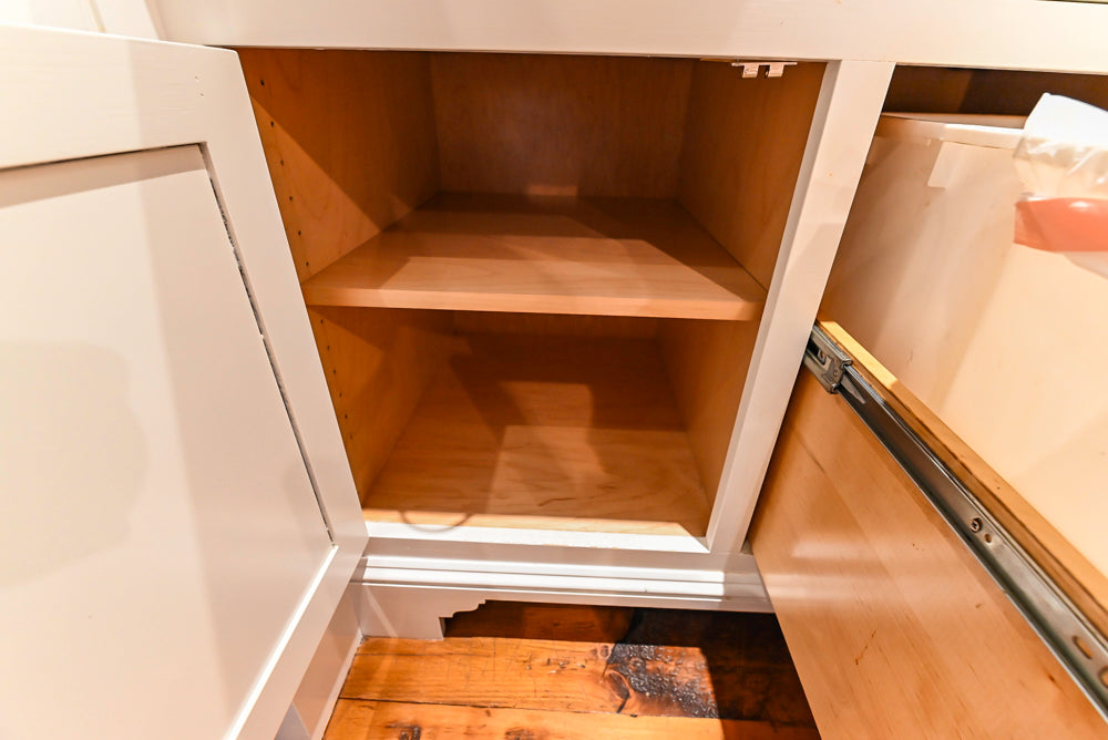 Rustic Traditional White & Navy Kitchen with Black AGA Range, Wood Top Island & Soapstone Countertops