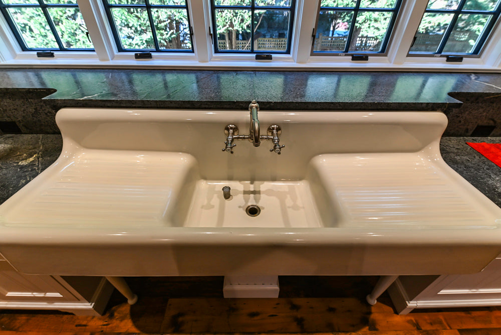Rustic Traditional White & Navy Kitchen with Black AGA Range, Wood Top Island & Soapstone Countertops