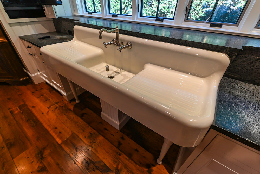 Rustic Traditional White & Navy Kitchen with Black AGA Range, Wood Top Island & Soapstone Countertops