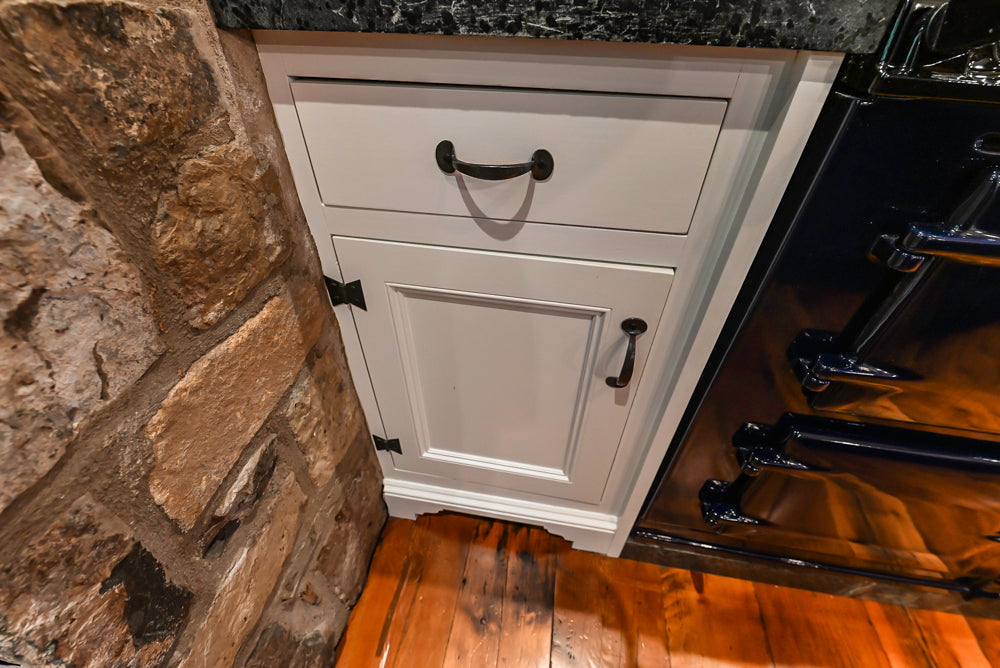 Rustic Traditional White & Navy Kitchen with Black AGA Range, Wood Top Island & Soapstone Countertops