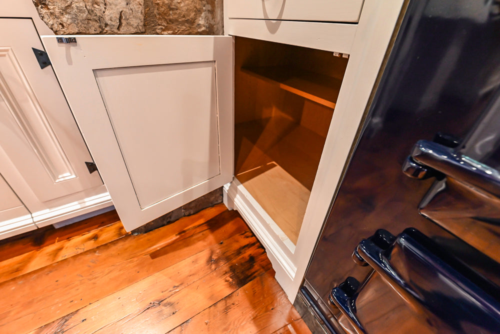 Rustic Traditional White & Navy Kitchen with Black AGA Range, Wood Top Island & Soapstone Countertops