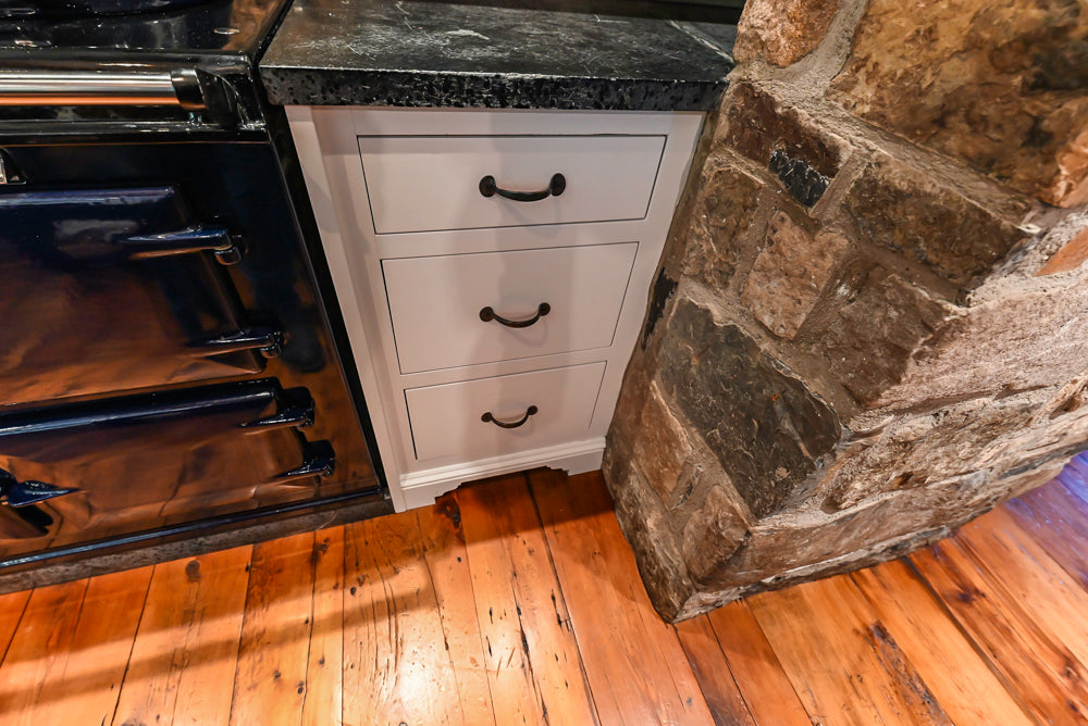 Rustic Traditional White & Navy Kitchen with Black AGA Range, Wood Top Island & Soapstone Countertops