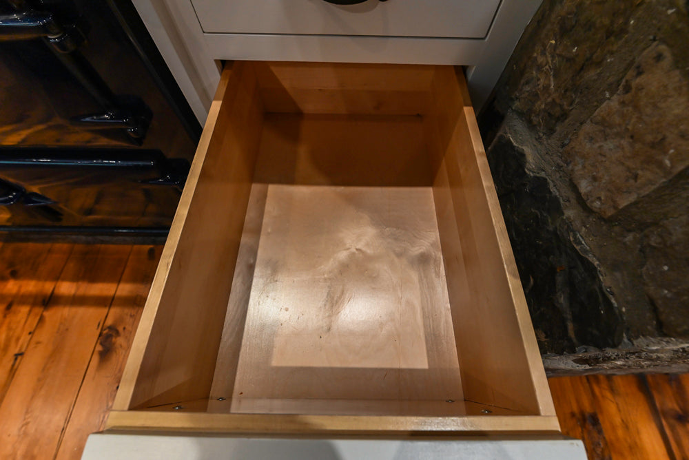 Rustic Traditional White & Navy Kitchen with Black AGA Range, Wood Top Island & Soapstone Countertops