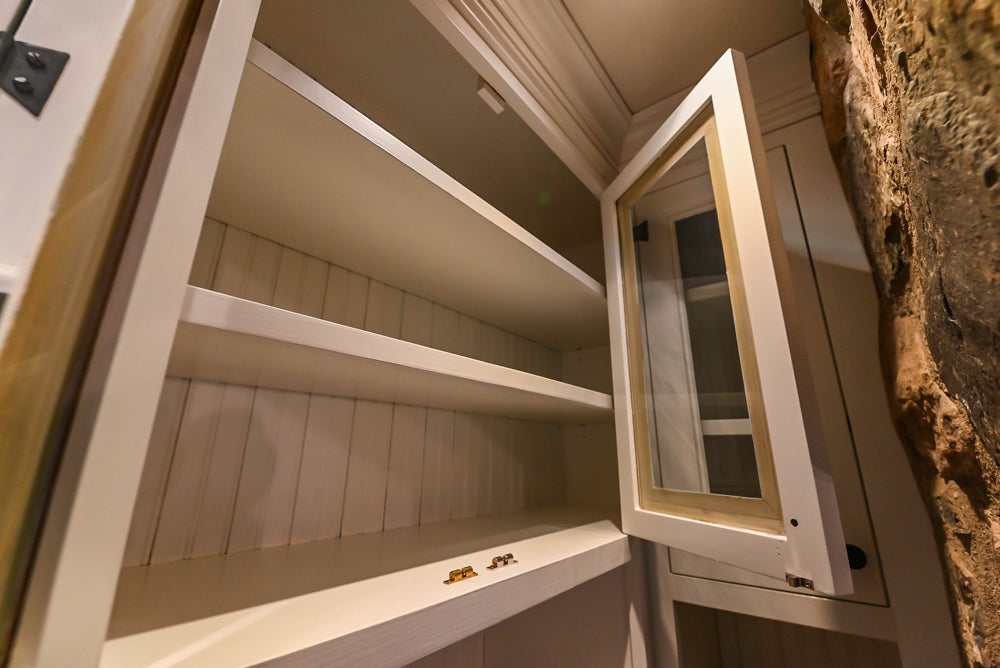 Rustic Traditional White & Navy Kitchen with Black AGA Range, Wood Top Island & Soapstone Countertops