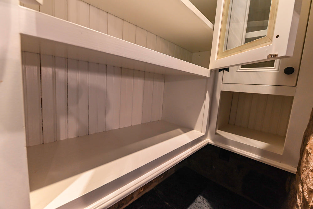Rustic Traditional White & Navy Kitchen with Black AGA Range, Wood Top Island & Soapstone Countertops