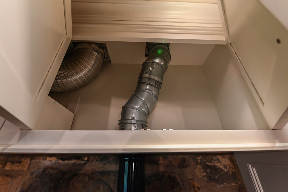 Rustic Traditional White & Navy Kitchen with Black AGA Range, Wood Top Island & Soapstone Countertops