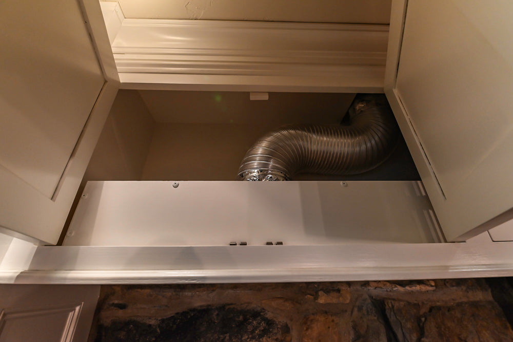 Rustic Traditional White & Navy Kitchen with Black AGA Range, Wood Top Island & Soapstone Countertops