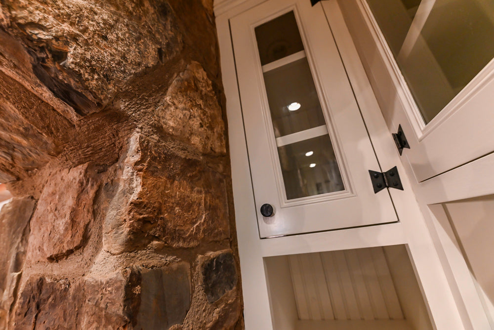 Rustic Traditional White & Navy Kitchen with Black AGA Range, Wood Top Island & Soapstone Countertops