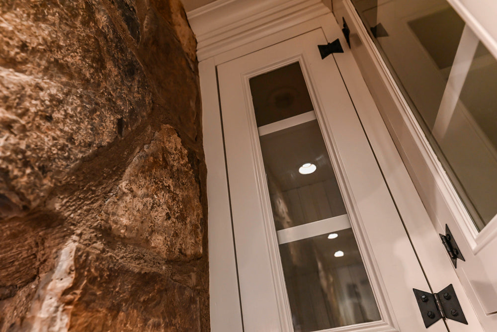 Rustic Traditional White & Navy Kitchen with Black AGA Range, Wood Top Island & Soapstone Countertops