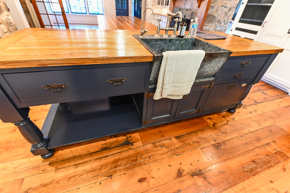 Rustic Traditional White & Navy Kitchen with Black AGA Range, Wood Top Island & Soapstone Countertops