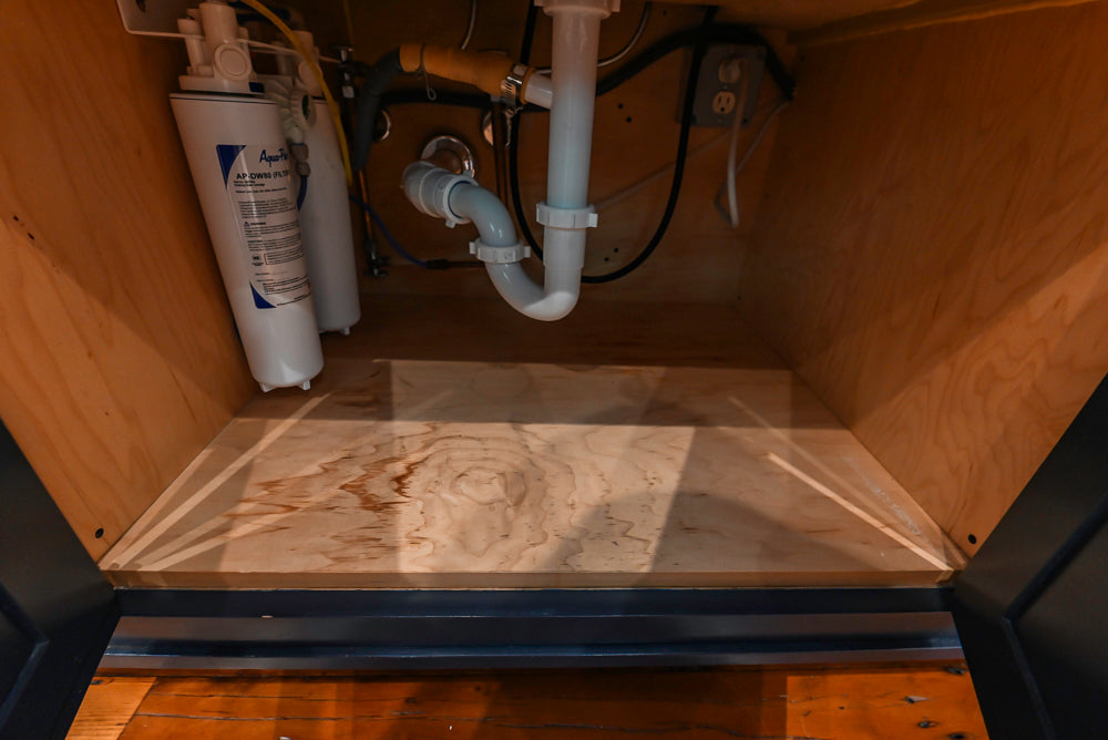 Rustic Traditional White & Navy Kitchen with Black AGA Range, Wood Top Island & Soapstone Countertops