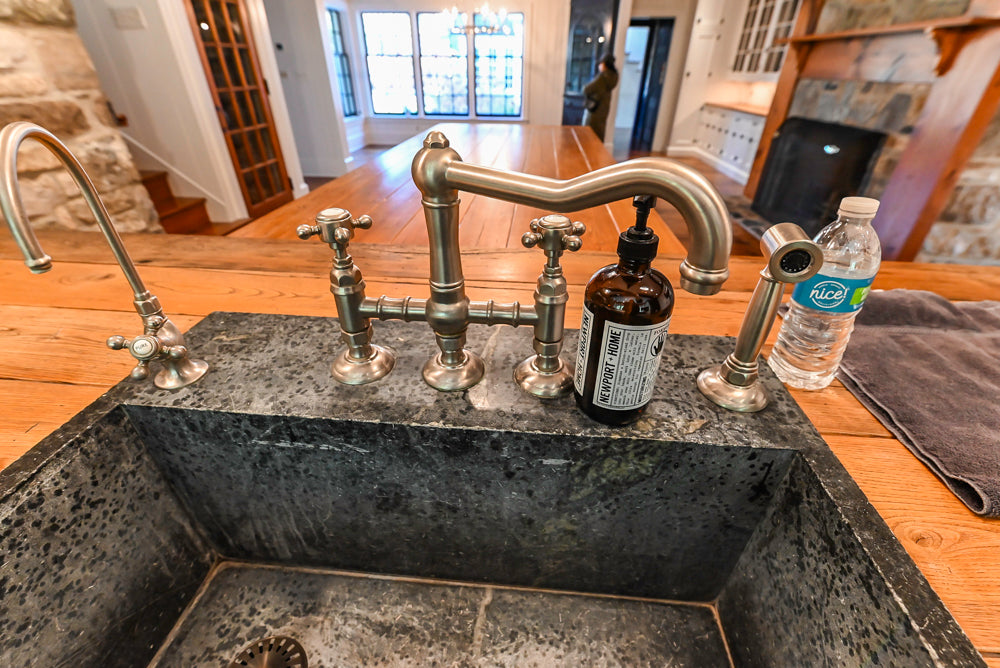 Rustic Traditional White & Navy Kitchen with Black AGA Range, Wood Top Island & Soapstone Countertops