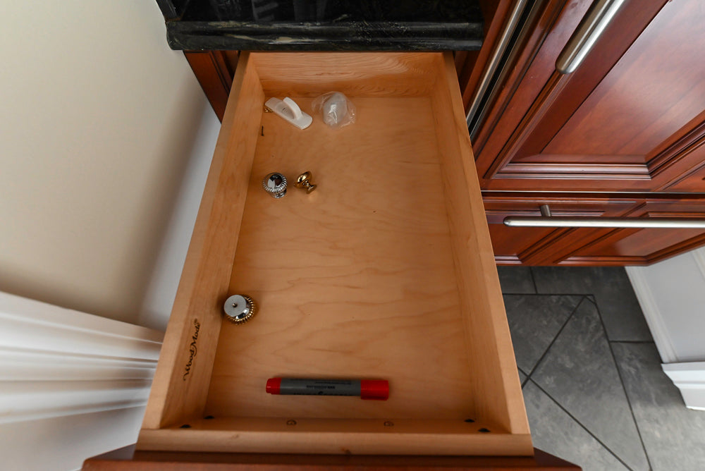 Wood-Mode Traditional Pantry with Dark Granite Countertop & Sub-Zero Refrigerator