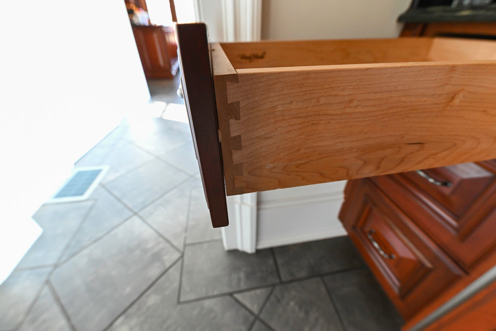 Wood-Mode Traditional Pantry with Dark Granite Countertop & Sub-Zero Refrigerator
