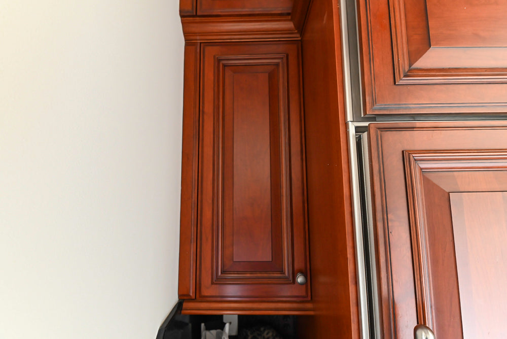 Wood-Mode Traditional Pantry with Dark Granite Countertop & Sub-Zero Refrigerator