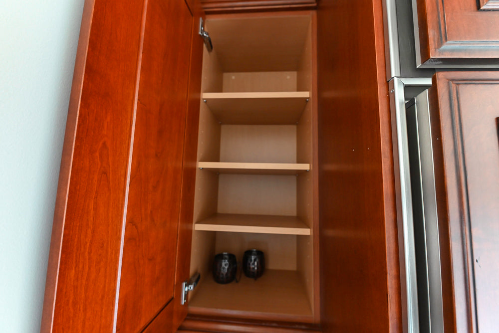 Wood-Mode Traditional Pantry with Dark Granite Countertop & Sub-Zero Refrigerator