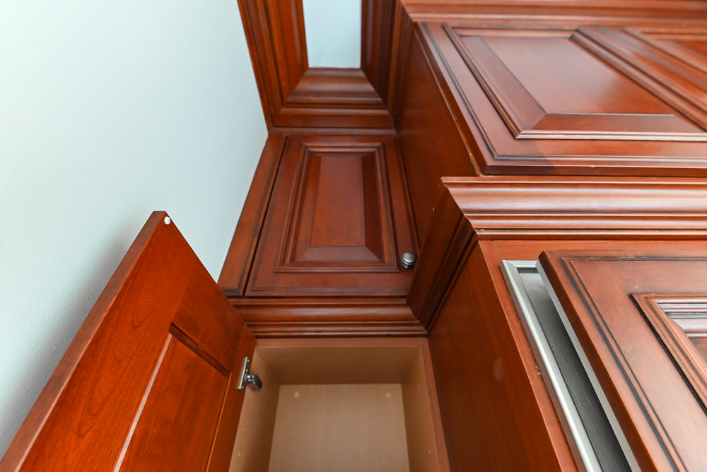Wood-Mode Traditional Pantry with Dark Granite Countertop & Sub-Zero Refrigerator