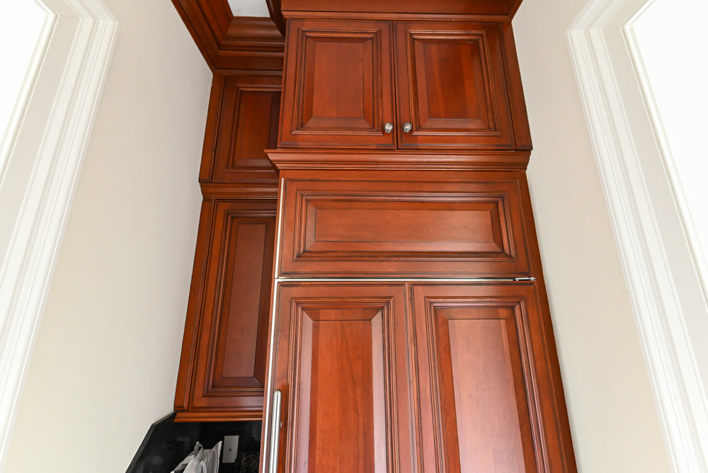 Wood-Mode Traditional Pantry with Dark Granite Countertop & Sub-Zero Refrigerator