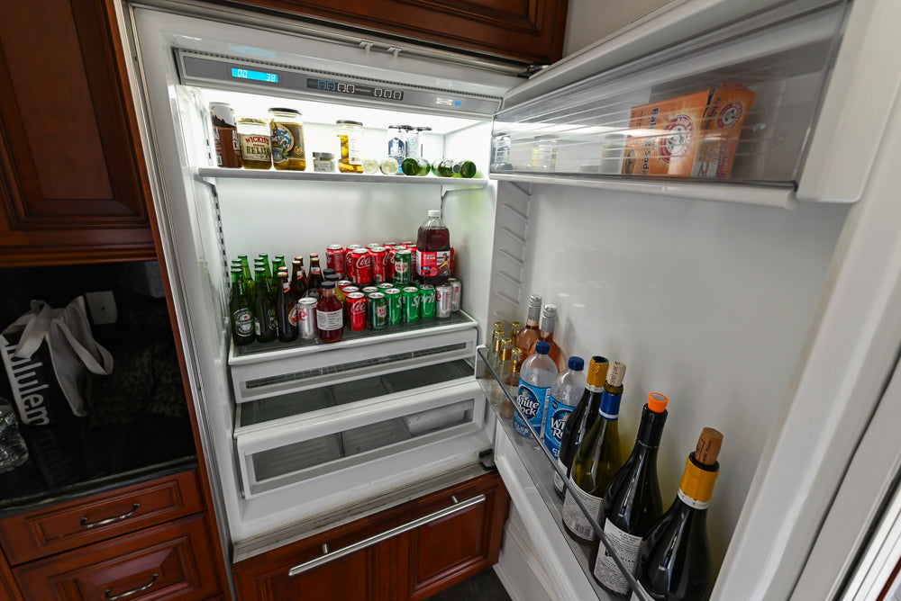 Wood-Mode Traditional Pantry with Dark Granite Countertop & Sub-Zero Refrigerator