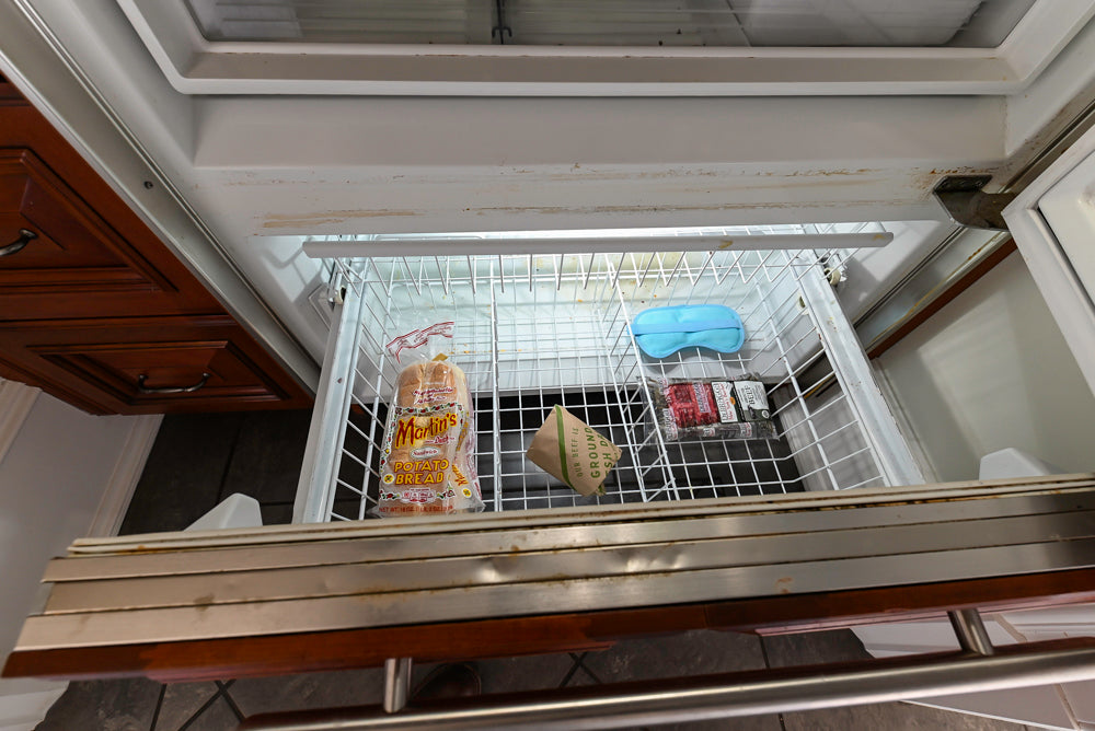 Wood-Mode Traditional Pantry with Dark Granite Countertop & Sub-Zero Refrigerator