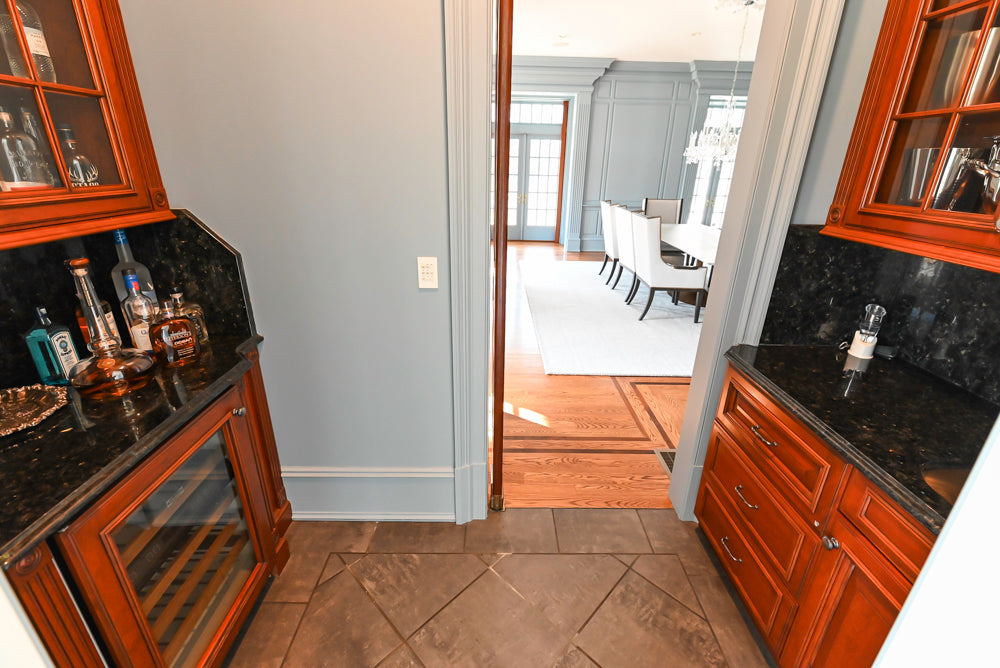 Wood-Mode Traditional Wet Bar with Dark Granite Countertops & Sub-Zero Wine Cooler