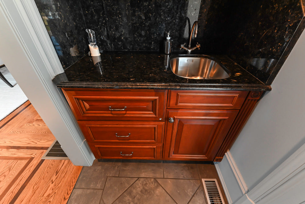 Wood-Mode Traditional Wet Bar with Dark Granite Countertops & Sub-Zero Wine Cooler