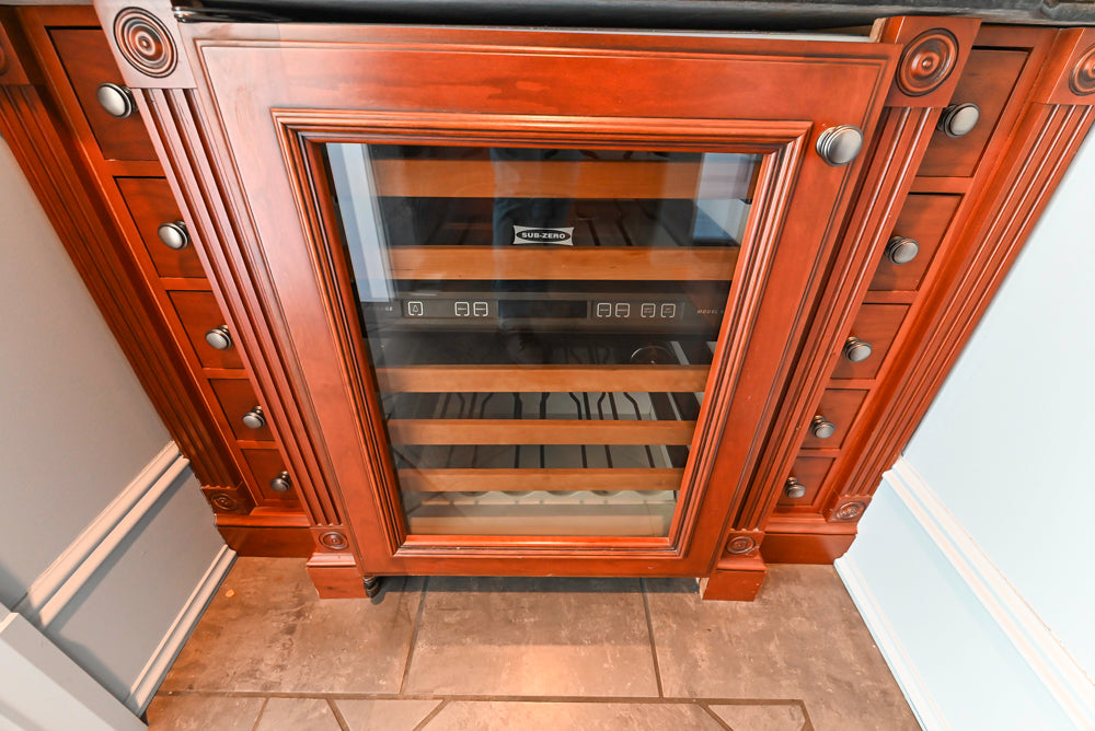 Wood-Mode Traditional Wet Bar with Dark Granite Countertops & Sub-Zero Wine Cooler