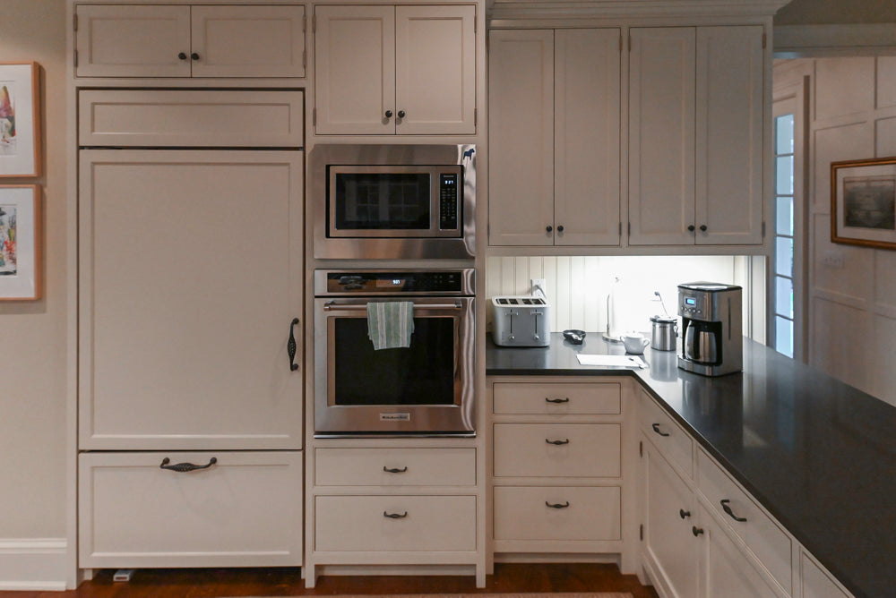 Large Traditional White Kitchen with Island, Stone Countertops & Desk Area