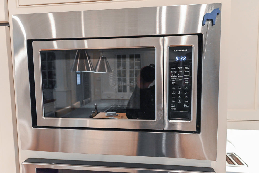 Large Traditional White Kitchen with Island, Stone Countertops & Desk Area