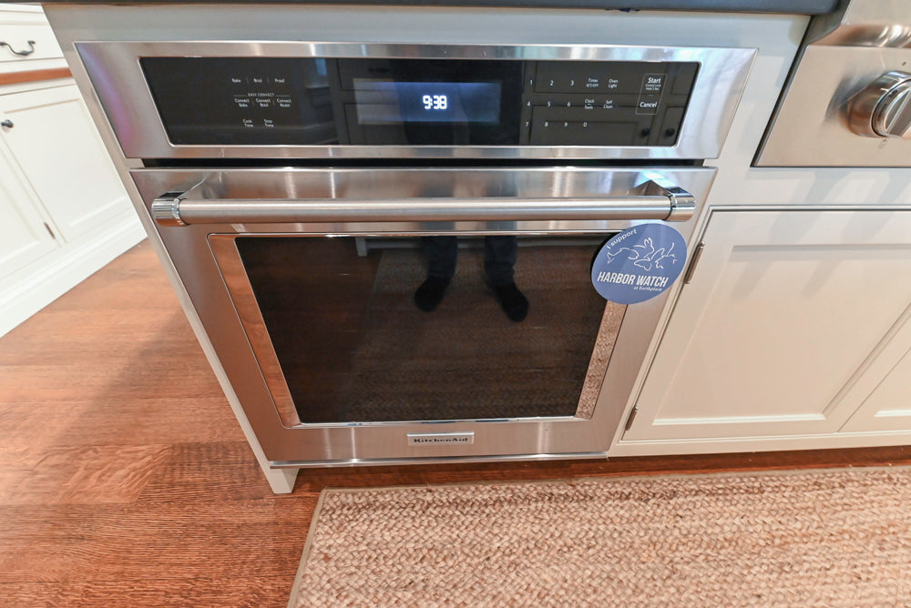 Large Traditional White Kitchen with Island, Stone Countertops & Desk Area