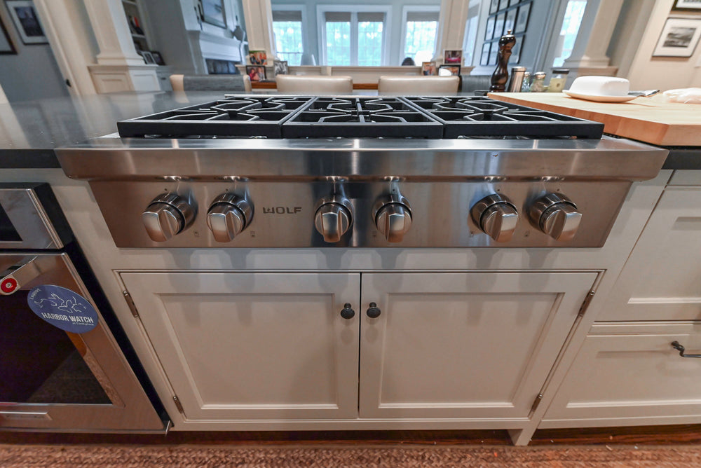 Large Traditional White Kitchen with Island, Stone Countertops & Desk Area
