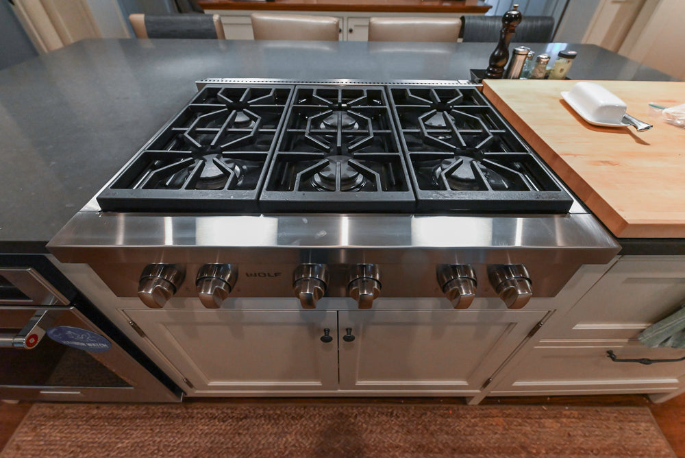 Large Traditional White Kitchen with Island, Stone Countertops & Desk Area