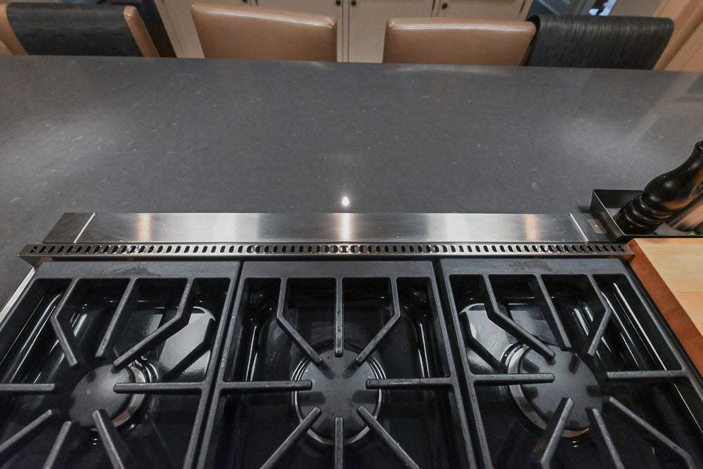 Large Traditional White Kitchen with Island, Stone Countertops & Desk Area