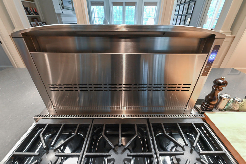Large Traditional White Kitchen with Island, Stone Countertops & Desk Area