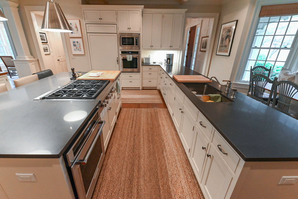 Large Traditional White Kitchen with Island, Stone Countertops & Desk Area