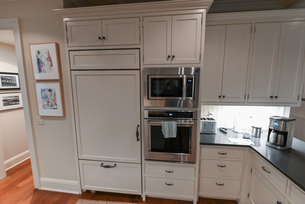 Large Traditional White Kitchen with Island, Stone Countertops & Desk Area