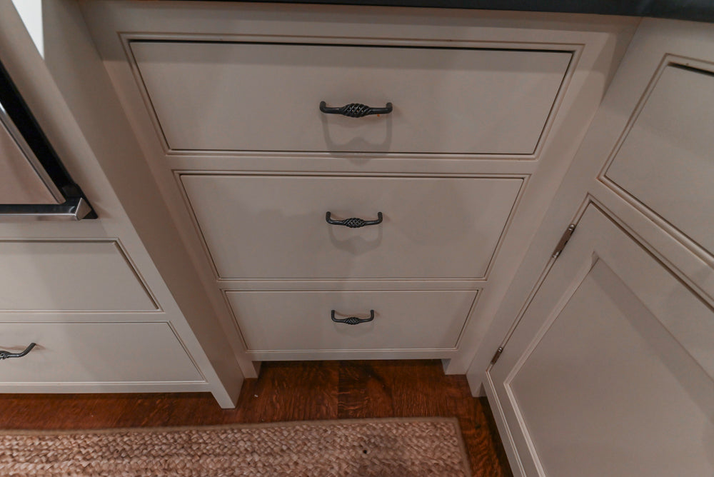 Large Traditional White Kitchen with Island, Stone Countertops & Desk Area
