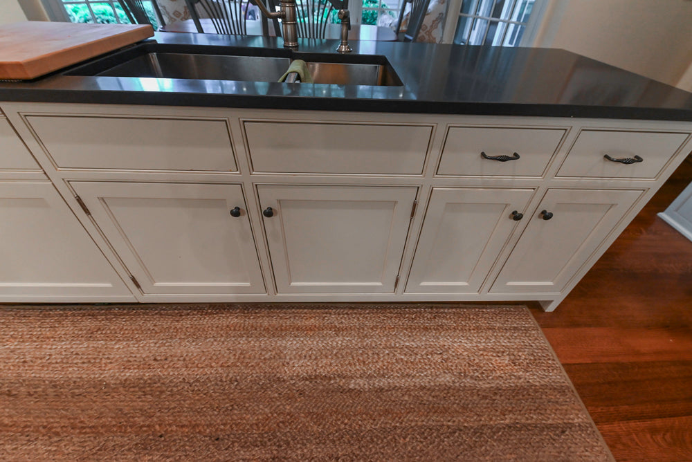 Large Traditional White Kitchen with Island, Stone Countertops & Desk Area