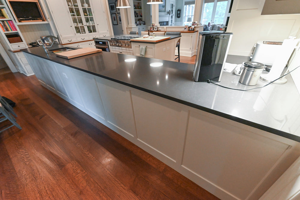 Large Traditional White Kitchen with Island, Stone Countertops & Desk Area
