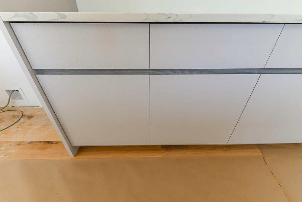 Large White Modern Kitchen with Island and Quartz Countertops
