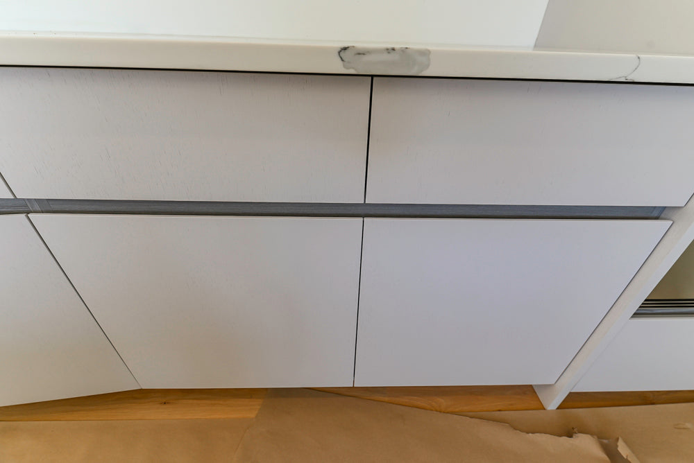 Large White Modern Kitchen with Island and Quartz Countertops
