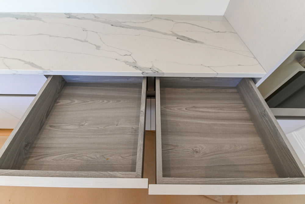 Large White Modern Kitchen with Island and Quartz Countertops