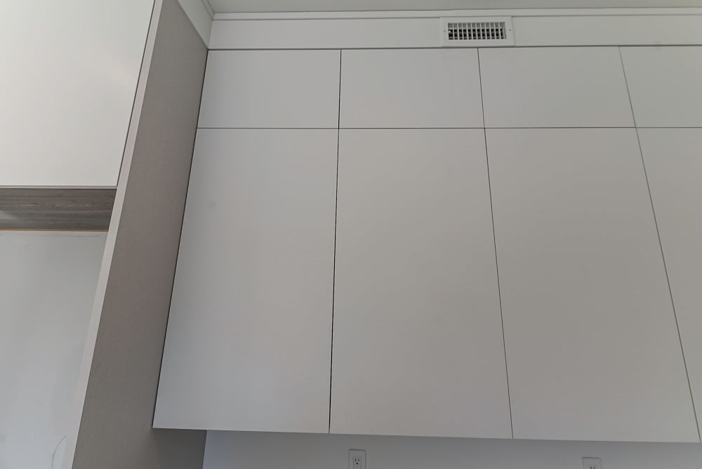 Large White Modern Kitchen with Island and Quartz Countertops