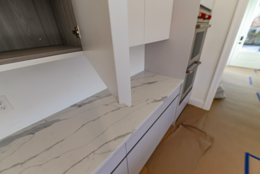 Large White Modern Kitchen with Island and Quartz Countertops