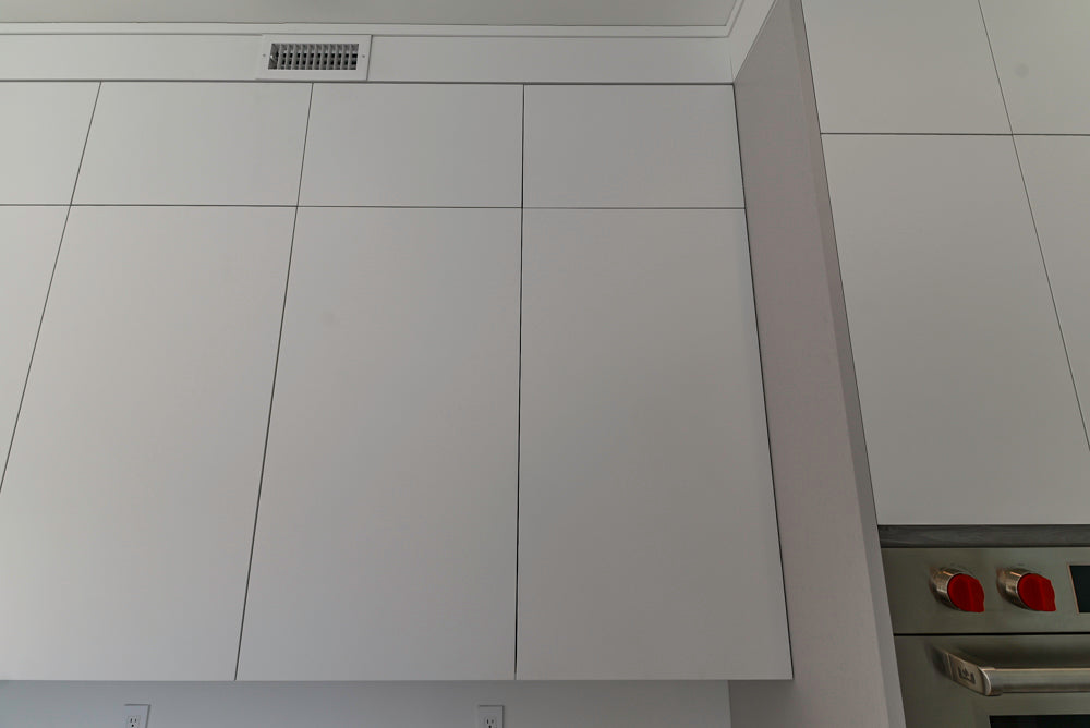 Large White Modern Kitchen with Island and Quartz Countertops